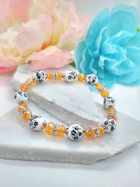 Handmade Halloween Beaded Bracelet: Black Floral & Orange Crystal Jewelry