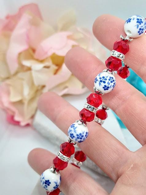 Blue Porcelain Flower Bracelet: Red Crystal Beaded Stretch Jewelry